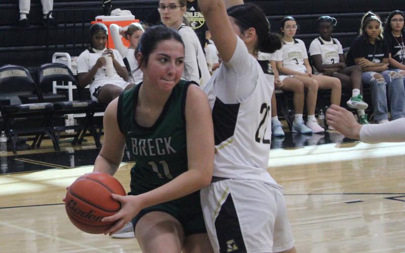 (Photo/Alex Kielar) Paisley Thibodeaux fights against Mackenzie Baker in the paint during the Lady Bucks’ opening game 39-36 win Saturday, Nov. 8 over Abilene High. 