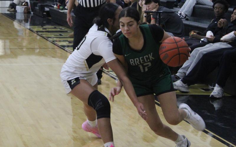 (Photo/Alex Kielar) Ra’Shay Losh drives past a Lady Eagles’ defender during the Lady Bucks’ opening game of the season Saturday, Nov. 8 at Abilene High, which they won 39-36. 