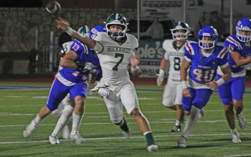 (Photo/Alex Kielar) Joseph Juneau attempts a short pass to his right side prior to the pressure getting to him from Childress, as the Bucks lost 21-14 Friday, Sept. 5. 