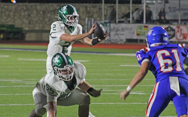 (Photo/Alex KielHudson Woodward takes the snap in the fourth quarter as the Bucks drove down the field, down 21-7, before they found the end zone to draw closer to Childress Friday, Sept. 5. ar) 