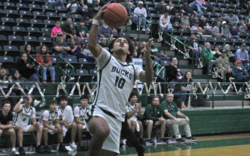 (Photo/Alex Kielar) Jaime Cruz goes up for a layup in the second half against the Roscoe Plowboys in the Buckaroos’ season-opening 46-42 victory Friday, Nov. 21. Cruz was a top facilitator for the Bucks’ offense with nine points. 