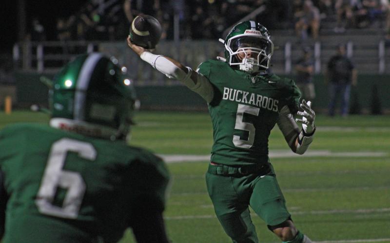 (Photo/Alex Kielar) Buckaroos quarterback Cooper Wimberly throws a pass towards the end zone in the second half of an 18-14 loss Friday, Sept. 12 to the Cisco Loboes. 