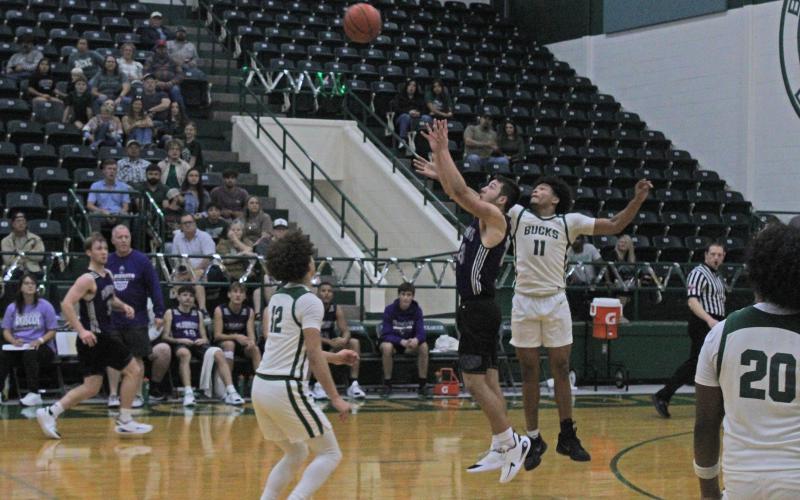 (Photo/Alex Kielar) The final heave up court by Roscoe was knocked down by Douglas White as the Buckaroos outlasted the Plowboys in their season-opening game, 46-42, Friday, Nov. 21. 