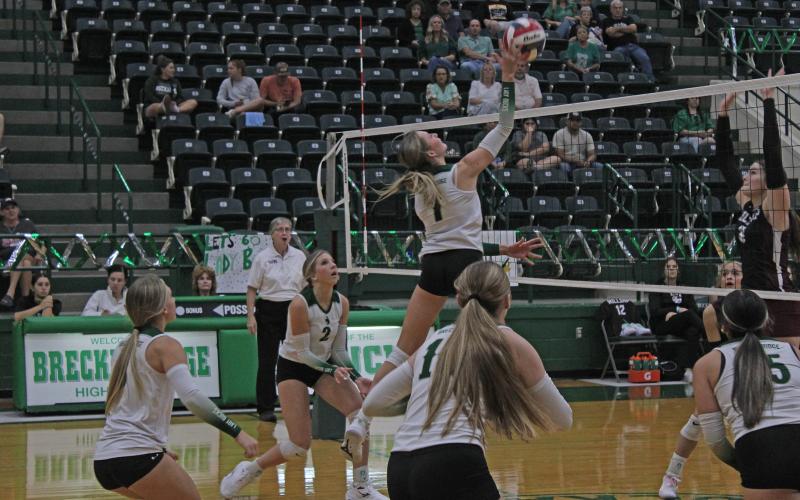 (Photo/Alex Kielar) Kamden Tidwell hits the ball over the net during the first set of the Lady Bucks’ three-set win over the Millsap Lady Bulldogs at home Friday, Sept. 26. 