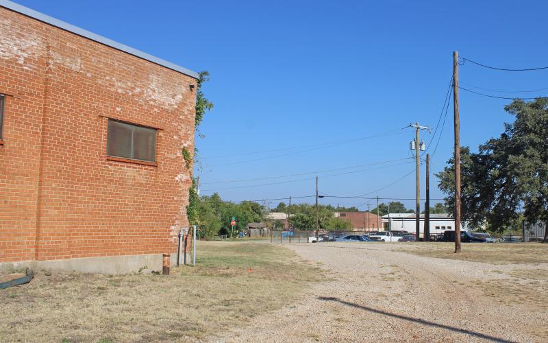 (Photo/Alex Kielar) This alley is part of the property that holds the former YMCA building seen to the left. The city commission approved the closure of the alley Tuesday, Oct. 14 in order to replat the property and potentially use the building as the new location for the BFD fire station. 