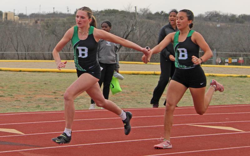 (File Photo/Alex Kielar) Kamden Tidwell takes the baton from Abbigail Duran during last track season’s girls 4x200 of the Buckaroo Relays at the track behind South Elementary. The track is set to be resurfaced over the next couple of months after the BISD school board approved the construction bid Monday, Oct. 13. 