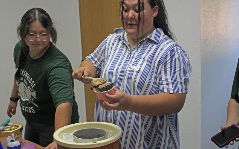 (Photo/Alex Kielar) Rylee Fuller scoops ice cream into a cup at the Breckenridge FFA ice cream social last month to kick off the 2025-2026 FFA season. Fuller, next to her sister Rihana, was recently selected to represent the Breckenridge FFA in the National FFA Band at the 98th National FFA Convention & Expo in Indianapolis next month. 