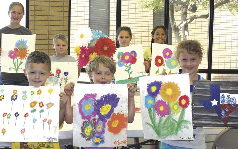 Art students show off their work during the Kids and Art Camp. In front, l-r, are Gabryel Moore and Mara and Aurrin Matheson. In back are: Leslie Abbott, Pretin and Providence Ezell and Taylor Champion.
