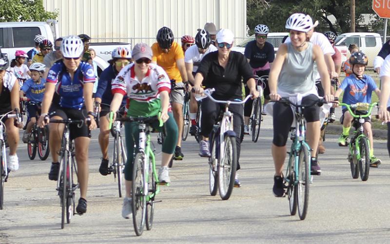 Members of the Everett family and friends take off  at the starting line near Miller Park Saturday.