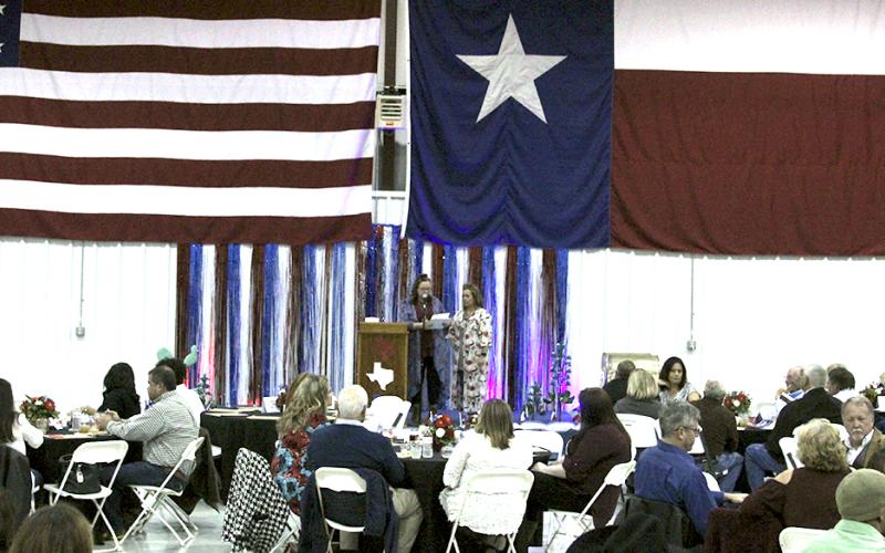Hundreds gather in a hanger at Stephens County Airport during the annual Breckenridge Chamber of Commerce.