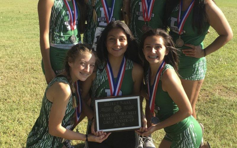 The Lady Buckaroo Cross Country Team poses for a photo with their second-place plaque.