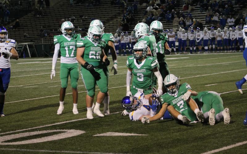 The Bucks defense stops a run play. The Bucks defense held stout against the run all night, but gave up a few big pass plays. BA photo by James Norman