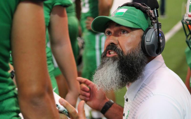 Coach Brian Valenzuela coaches up the team on the sideline. BA photo by James Norman