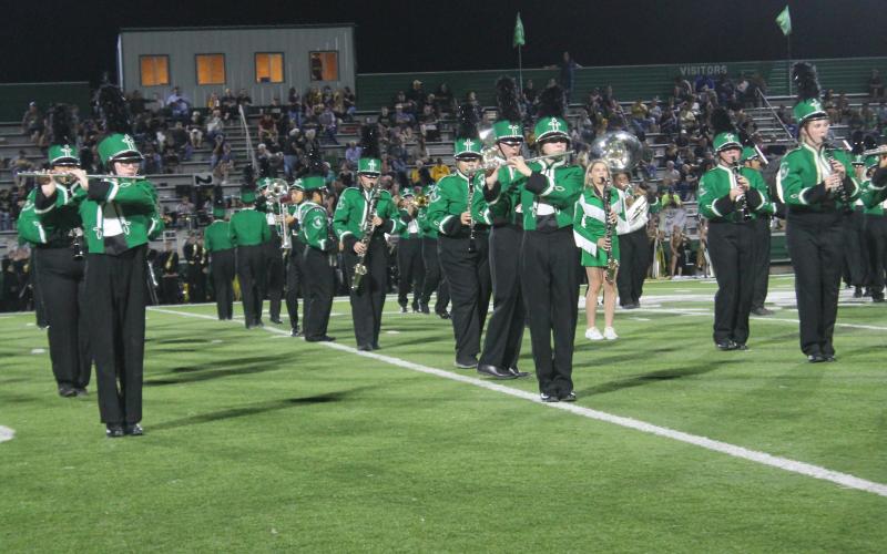 The marching band performs at halftime. Prior to the game, the band held a tailgating event at United Grocery Store, where they served food and played for passing cars. BA photo by James Norman