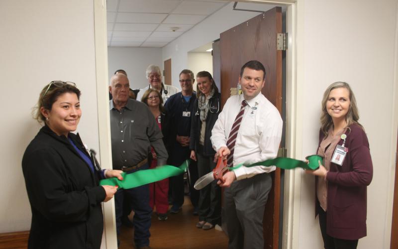 Stephens County Memorial Hospital CEO Matt Kempton cuts the ribbon to open the new nuclear lab facility. BA photo by James Norman