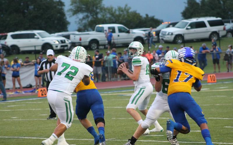 Owen Woodward drops back to complete a pass. Woodward had one touchdown on the day to Kevin Franco on the Bucks first drive. They did not score another touchdown. BA photo by James Norman