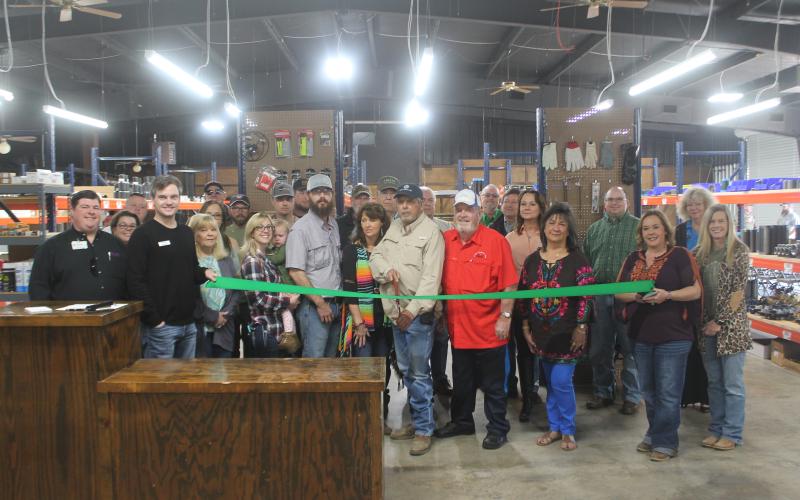 Gary Drake gets ready to cut the ribbon for Boss Oilfield Supply. Several representatives from Boss and the city were on-hand to cut the ribbon to signify the opening of the new business. Though, the business has been open since October of last year. BA photo by James Norman