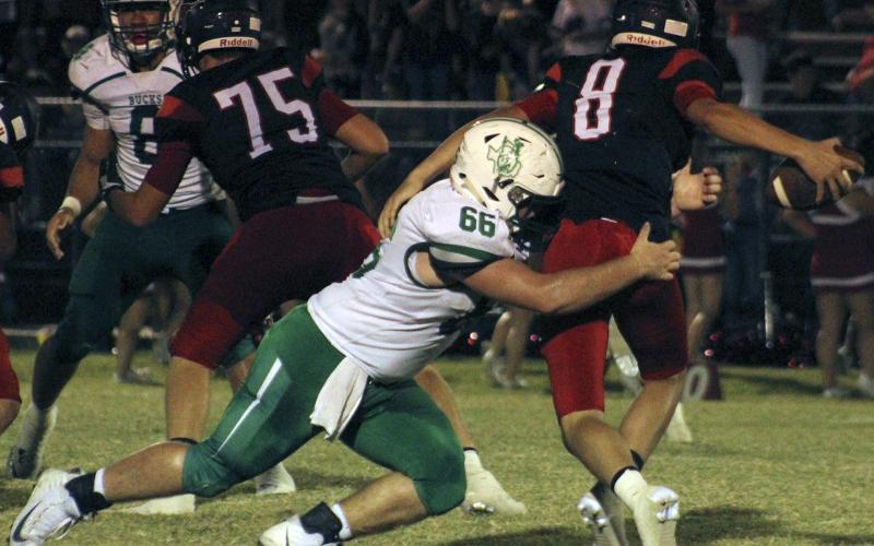 Junior defensive lineman Lane Berkley sacks Eastland’s quarterback.