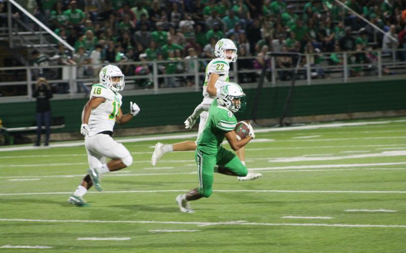 Angel Ruiz runs for a big gain in the first half. Ruiz's run would set the Bucks up near the end zone, but the drive would end in a turnover. BA photo by James Norman