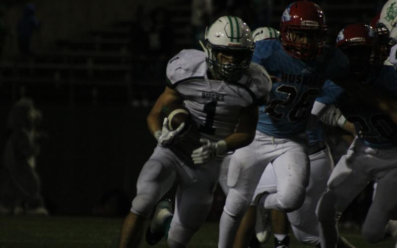 Senior Lonnie Hinson runs for a long gain against Hirschi.