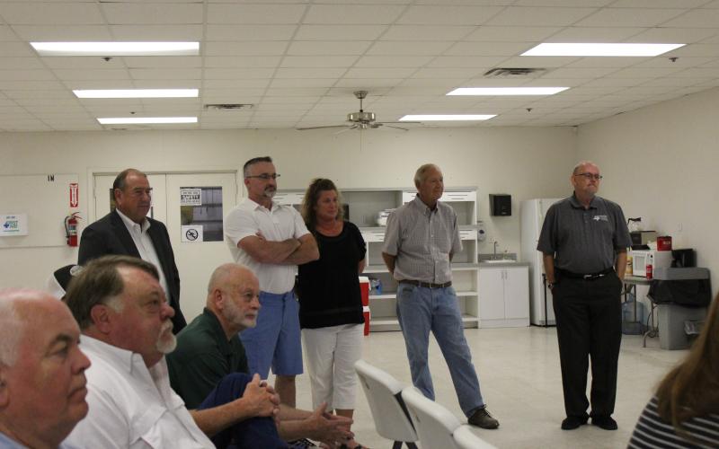 NewVision personnel are greeted by community leaders. In the foreground are Mike Parrack of Breckenridge InterBank, Stan Carstens of Carstens Motor Co., Andy McQuistion, City Manager and standing left to right, Steve Collins of Workforce Solutions,Bill Davidson, ProductionManager at NewVision, Stacy Davidson, office manager, Andy Nuert, Plant Manager for NewVision and Virgil Moore, executive director of the Breckenridge Economic Development Corporation. BA Photo by Jean Hayworth