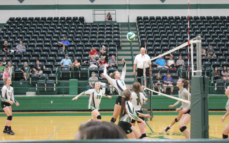 Anna Reaugh (5) has just gotten a set from Kinley Kanady (1) and goes up for a slam back at the Paradise defenders. Lady Bucks teammates McKinley Roberts (8), Grace Niklas (20) and Lilly Woodward (11) look on. The game was played at the Breckenridge ISD Athletic and Fine Arts Center, Tuesday, Sept. 18. BA photo by Jean Hayworth