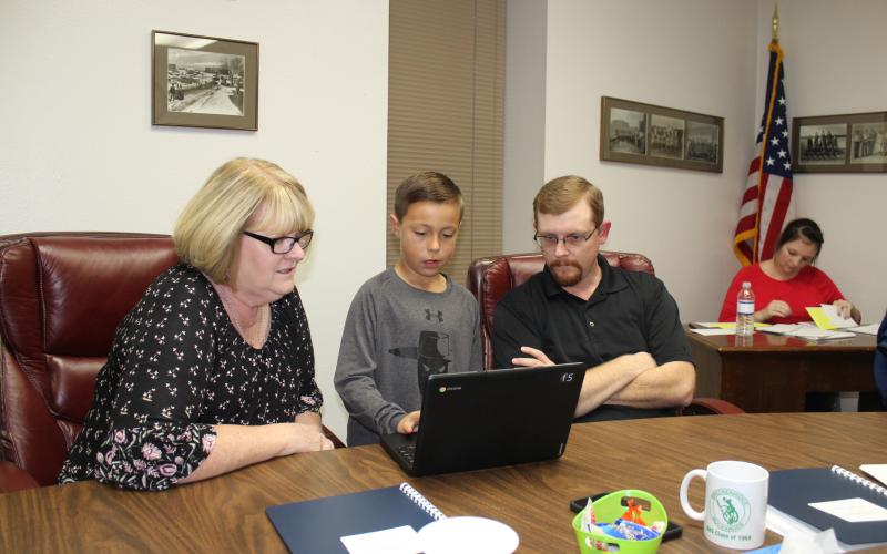 The G/T students from North Elementary demonstrated two math programs to BISD board members Monday, Oct. 15. This is Cooper Wimberley between Paige Townson and Russell Creager showing them how the math program works. BA photo by Jean Hayworth