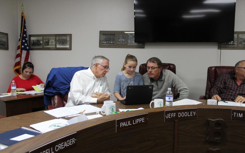 BISD board members Paul Lippe and Jeff Dooley are being schooled on a G/T math program by third-grader Teagan Deen, who is demonstrating a math problem on her Chrome Book that is used at North Elementary. BA photo by Jean Hayworth