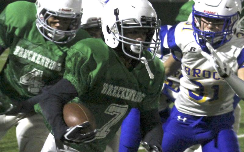 A Breckenridge Junior High School running back rushes for a big gain during last Thursday's season finale.