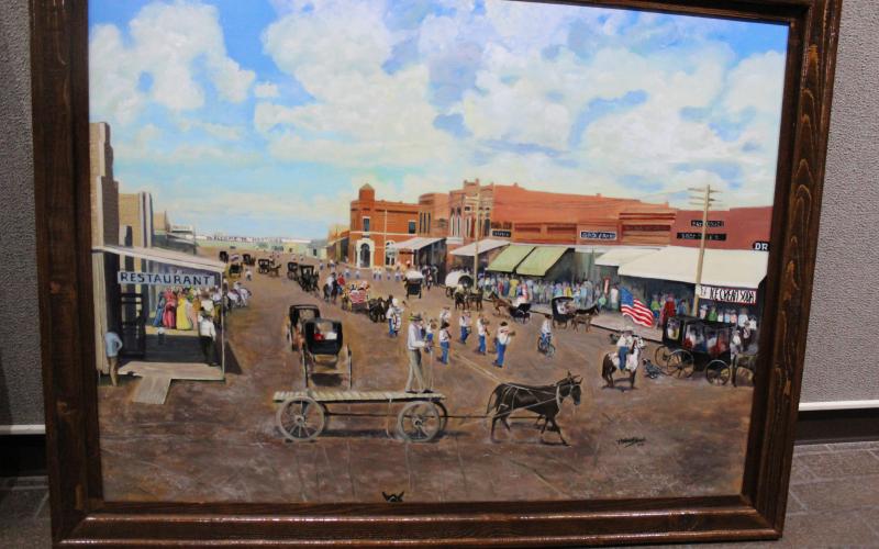 The Breckenridge Fine Arts Center begins a new exhibit, "History of the Common Man," by Tonya Holmes Shook. This painting, by Shook, is of a parade down the main street of Hastings, Okla., just two years after statehood. The occasion was the laying of the cornerstone at the new school.  BA photo by Jean Hayworth