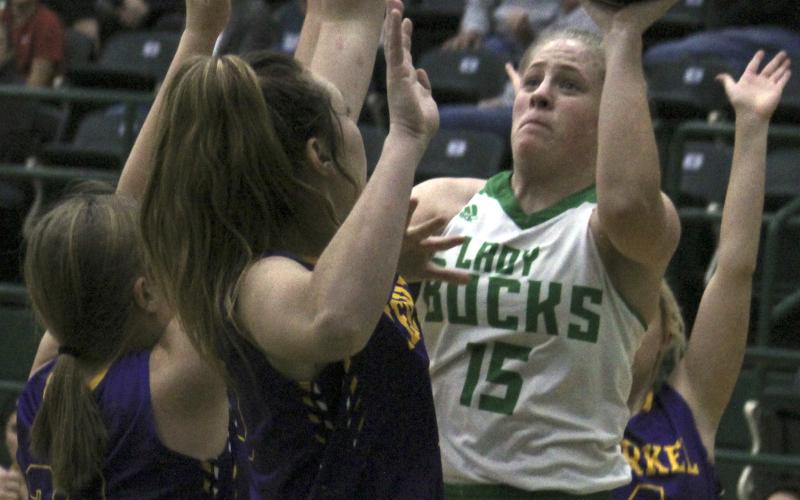 Swarmed by Merkel defenders, Breckenridge senior Carley Tennison puts in a basket Monday night. Tennison led the Lady Bucks in scoring with 11 points.