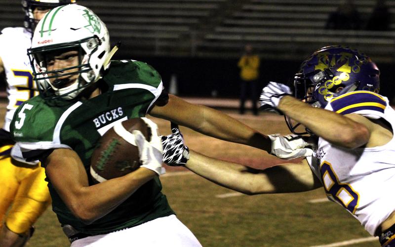 Breckenridge High School junior receiver Kevin Franco tears away from a Merkel defender during last Friday’s playoff game in Brownwood. Franco led the Buckaroos in receiving with six receptions for 64 yards.