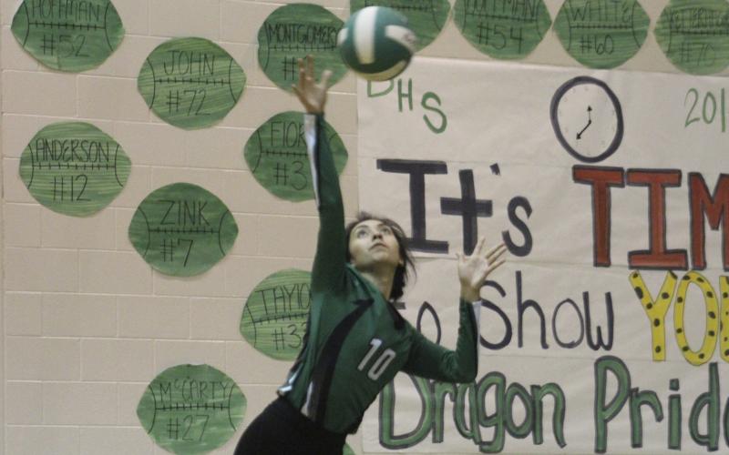 Maria Alvarado hits five consecutive aces during Saturday's four-set victory.