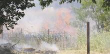 Firefighters have responded to an uptick in grass fires across Stephens County this week. From June 26 through June 30, firefighters responded to calls on Hwy. 180 E, CR 262 (pictured) and twice on FM-2231. Photo/Mike Williams
