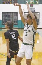 Joseph Juneau puts up a three-point shot in the fourth quarter of the Bucks’ 47-44 win over Millsap Friday, Jan. 31 in which he scored 10 points. Photo/Alex Kielar