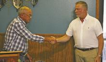 JB Sparks (right) is congratulated by Les Strickland after taking the oath as Rotary Club of Breckenridge president. Photo/Mike Williams