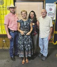 Stephens County Sheriff Kevin Roach was awarded with a plaque from Colleen Horan of Carter BloodCare and Battle of the Badges co-coordinators Les and Sherry Strickland during the Rotary Club of Breckenridge’s weekly meeting Tuesday, Aug. 8. Photo/Mike Williams