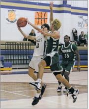 Breckenridge’s Cam Escalon looks to block the shot of Perrin’s Jack McCormick during their Thursday, Dec. 15 game in Perrin. Breckenridge needed double overtime, but avenged an earlier loss to the Pirates with a 77-74 road win. Photo/Brian Smith/Jacksboro Herald-Gazette