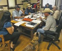 Stephens County Judge Michael Roach (back middle) reads a resolution supporting law enforcement’s efforts to prevent the use of fireworks on county property and roads. Photo/Mike Williams