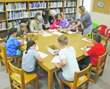 The Breckenridge Public Library hosted its first summer reading at the library Tuesday, June 6. After Breckenridge High School sophomore Providence Ezell read the book Faith The Cow, participants took part in a coloring activity. The summer reading program takes place eat 2 p.m. each Tuesday, except for July 4, at the library. Photo/Mike Williams