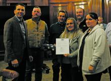 Former Stephens County Veterans Service Officer Don H. Smith was honored posthumously during the county meeting Monday, Nov. 14. Smith’s wife and daughter were in attendance to receive a flag he saluted this past Memorial Day. Photo/Stevie Watkins