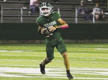 Joseph Juneau threw for a season-high three touchdowns in the Bucks’ 38-21 loss Friday, Oct. 11 at home to Clyde. Photo/Mike Williams