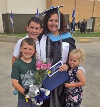 BHS Theater Arts teacher Cassie Johnson is congratulated by her family after she received her second Master’s degree last month from Angelo State University, a Master of Arts in Mental Health and Wellness Counseling. Photo/Contributed