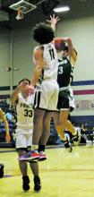 Karter Smalley shoots a jump shot over a Pirates defender during the second quarter of the Bucks’ 8258 loss Friday, Dec. 9 to Perrin-Whitt during the Red, White and Blue Tournament at Graham High School. Photos/Mike Williams