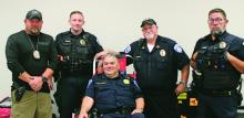 Breckenridge Police Chief Blake Johnson, middle, prepares to donate blood during the Battle of the Badges Blood Drive Thursday, June 5 and is joined by other members of his department. Photo/Alex Kielar