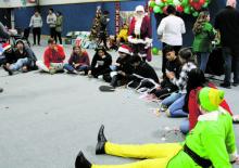 The Pride of Breckenridge Buckaroo band members gathered Monday, Dec. 19 to celebrate Christmas. Santa was in attendance and students were provided with a smoked brisket and baked potato dinner, cookie decorating kits, desserts, games, as well as a gift for each student. Photo/Stevie Watkins
