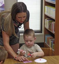 The summer reading program at the Breckenridge Library hit another week last Tuesday, June 10, as young students listened to another book being read to them and participated in an activity related to the book. Photo/Alex Kielar