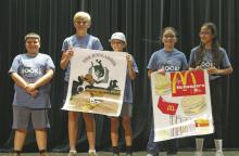 Two groups of Breckenridge ISD students, the Bookaroos and McReaders, show off their posters for the 2025 Battle of the Books contest. Students can improve their reading skills and book knowledge during the Breckenridge Public Library’s summer reading program, which begins Tuesday, June 3.