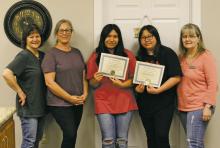 Marissa Martinez and Valerie Beltran completed 12 hours of community service at The Open Door over a six-week period for National Honor Society. They helped clean, sanitize and organize, as well as tie-dyed onesies and assisted with laundry. Photo/Kaci Funderburg