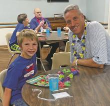 Mentor Glenn McGee meets with his mentee during a mentor event held by Virginia’s House in Graham. The mentor program has grown in volunteers recently but is still seeking support in both Stephens and Young counties. Contributed photo